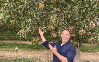 Jupiter Pistachios' Fouad Lilabadi in front of a pistachio tree